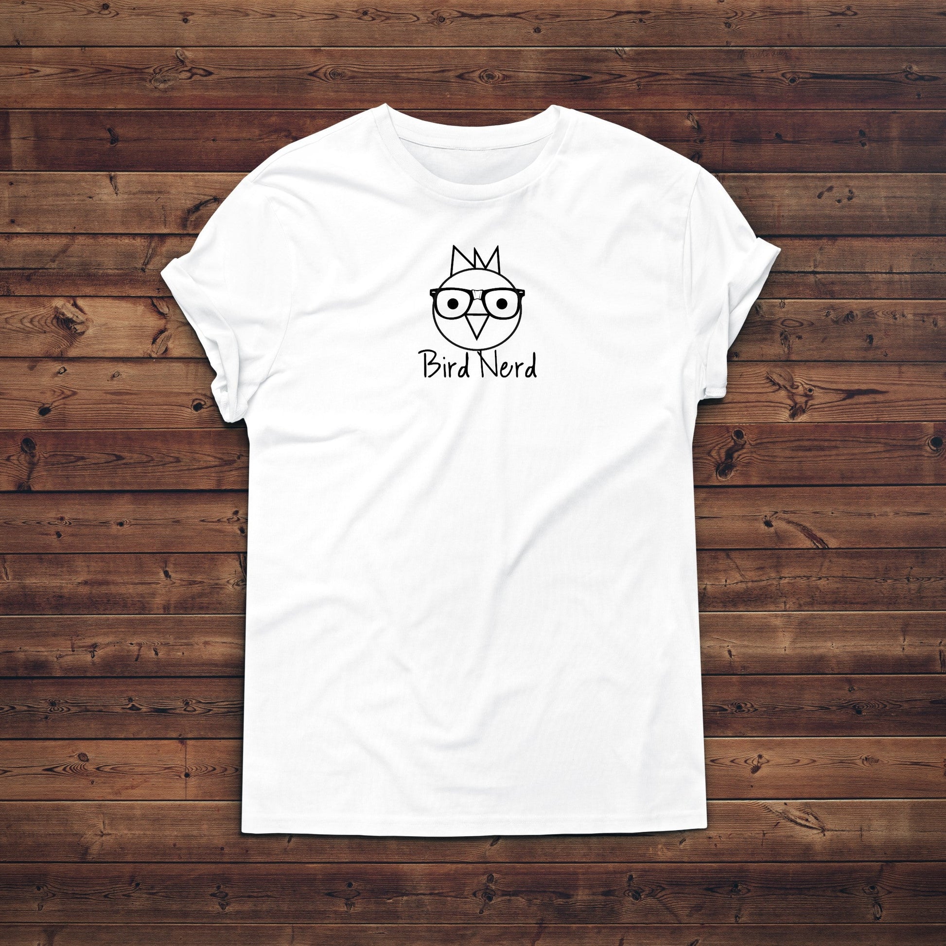 White t-shirt with a graphic design on a wooden background