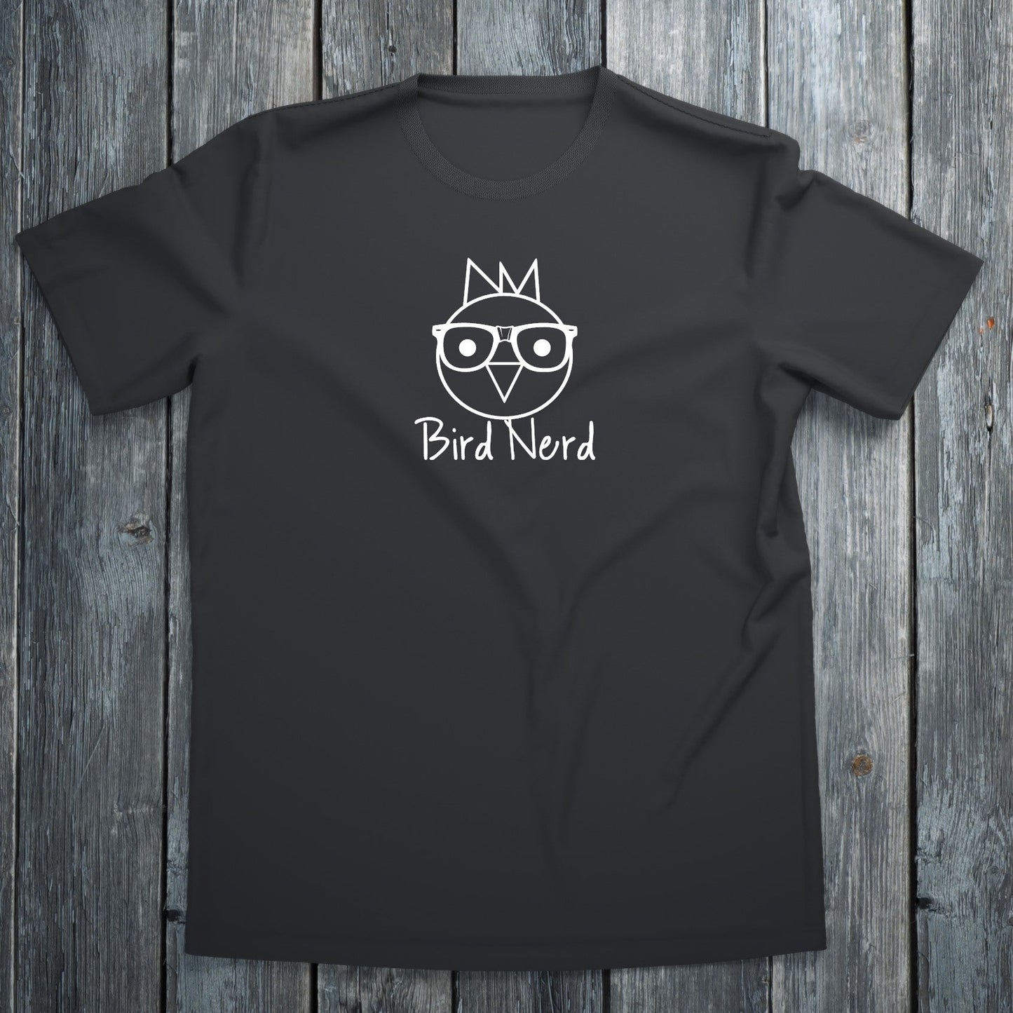 Black t-shirt with 'Bird Nerd' design on a wooden surface